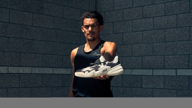 Trae Young wears his signature adidas basketball shoe in the 'SO SO DEF' colorway.